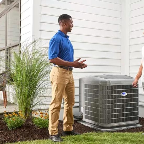 a-carrier-dealer-discusses-air-conditioner-and-ac-unit-options-with-a-homeowner-outside-his-home